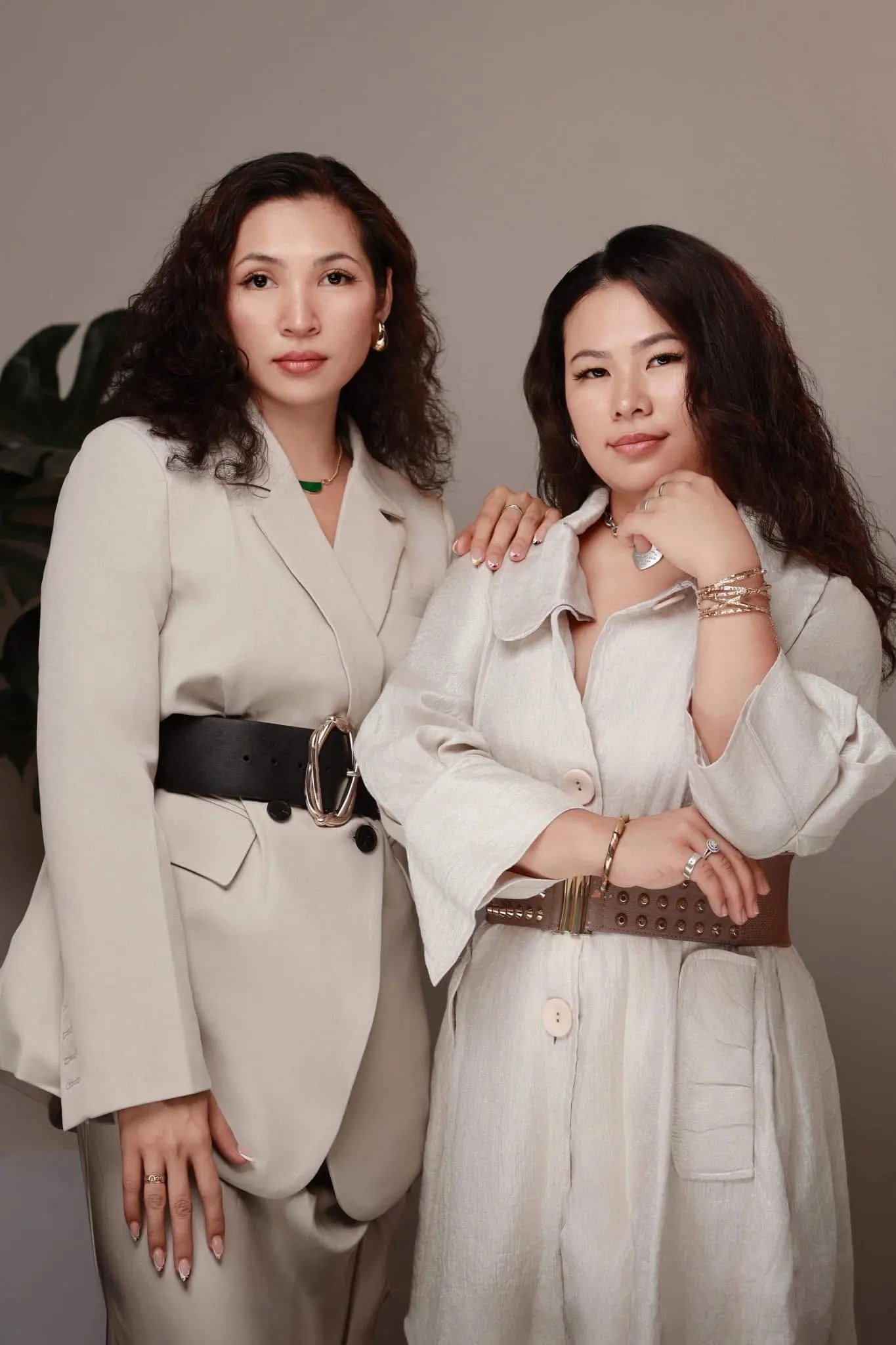 Mary-June HK with a fellow creator in coordinated neutral suits